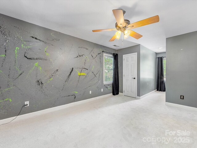 11126 Windgate Ct, Tega Cay, SC 29708 - spare room featuring a ceiling fan, healthy amount of natural light, and carpet floors