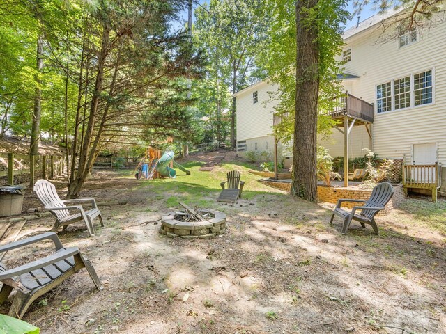 11126 Windgate Ct, Tega Cay, SC 29708 - view of yard featuring an outdoor fire pit and a deck