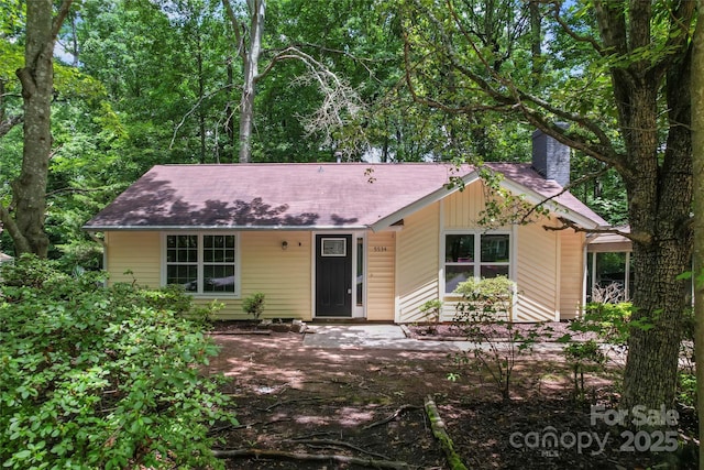 5534 Great Wagon Rd, Charlotte, NC 28215 - view of front of property featuring a chimney and roof with shingles