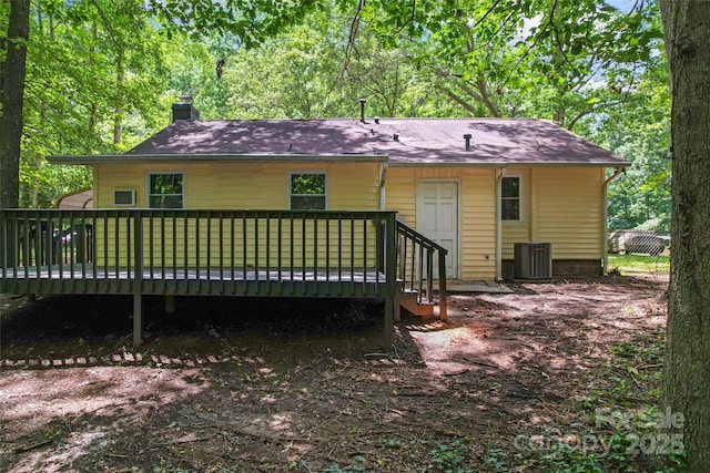 5534 Great Wagon Rd, Charlotte, NC 28215 - back of house featuring a chimney and a wooden deck