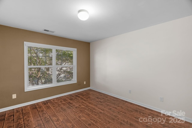 8325 Burgundy Ridge Dr, Harrisburg, NC 28075 - spare room with dark wood-style floors and baseboards