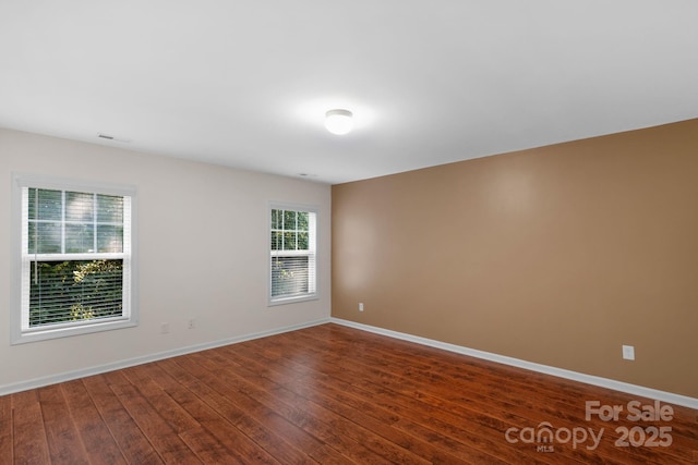 8325 Burgundy Ridge Dr, Harrisburg, NC 28075 - spare room with dark wood-style floors