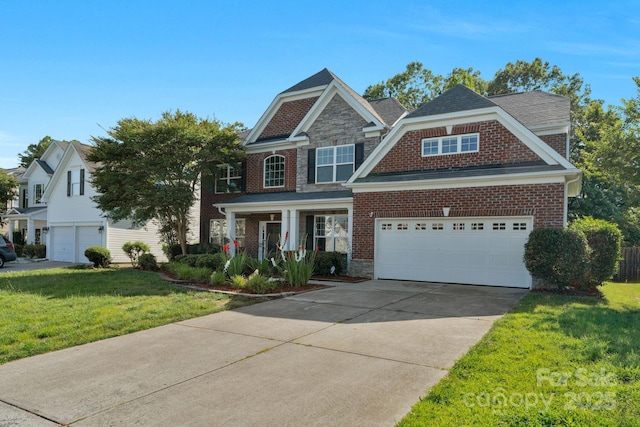 8325 Burgundy Ridge Dr, Harrisburg, NC 28075 - view of front of home with a front lawn, driveway, brick siding, and stone siding