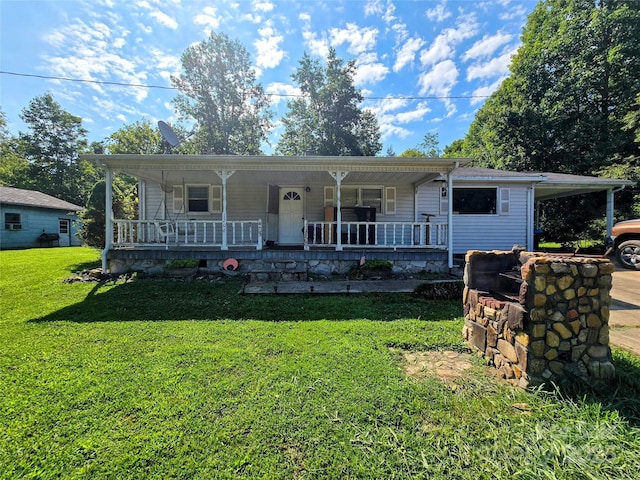 1206 Three Way Ln, Lenoir, NC 28645 - view of front facade with a porch, a front yard, and an attached carport