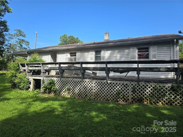 1206 Three Way Ln, Lenoir, NC 28645 - rear view of house featuring a wooden deck, a yard, and a chimney