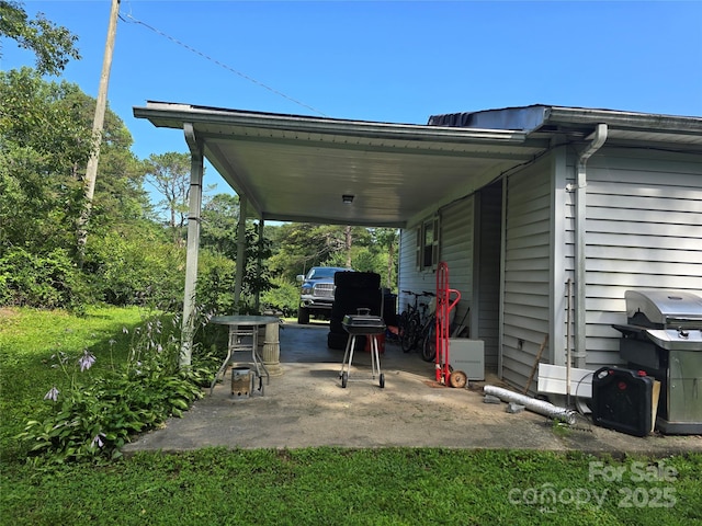 1206 Three Way Ln, Lenoir, NC 28645 - view of patio featuring a carport and area for grilling