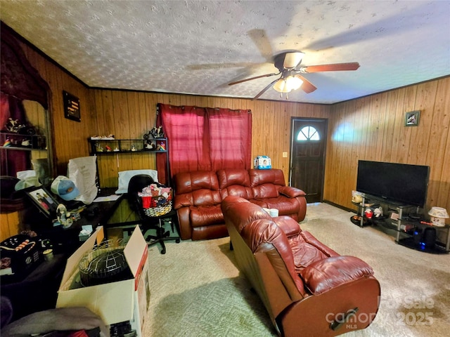 1206 Three Way Ln, Lenoir, NC 28645 - carpeted living area featuring ceiling fan, wood walls, and a textured ceiling