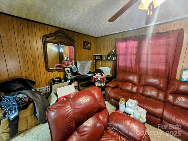 1206 Three Way Ln, Lenoir, NC 28645 - living area with wooden walls, a ceiling fan, and a textured ceiling