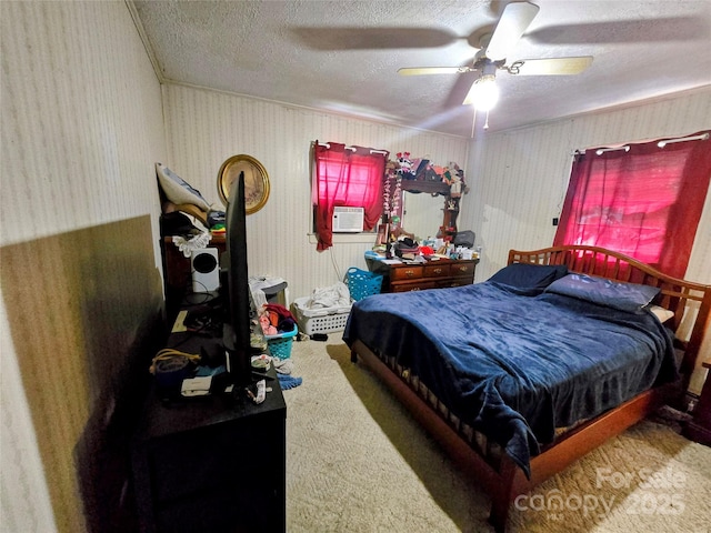 1206 Three Way Ln, Lenoir, NC 28645 - bedroom featuring carpet, a textured ceiling, cooling unit, a ceiling fan, and wallpapered walls