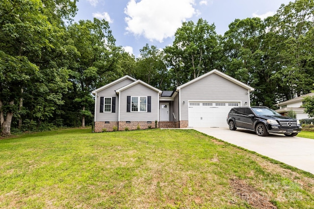 1005 8th Ave SW, Conover, NC 28613 - single story home featuring crawl space, concrete driveway, an attached garage, a front yard, and view of wooded area