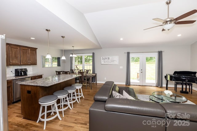 1005 8th Ave SW, Conover, NC 28613 - living area with french doors, ceiling fan, light wood finished floors, vaulted ceiling, and recessed lighting