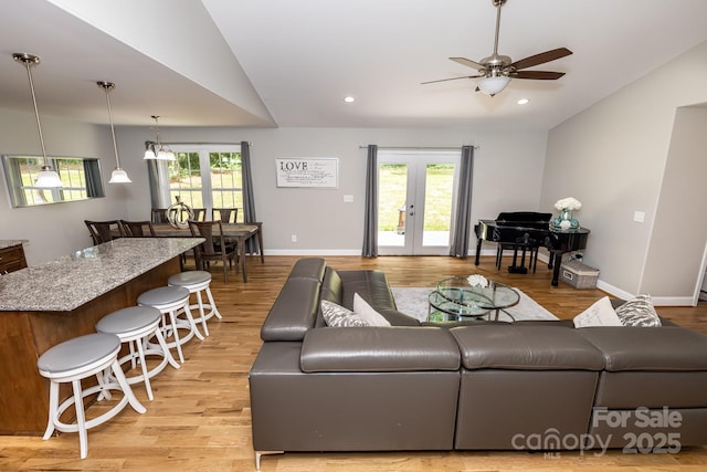 1005 8th Ave SW, Conover, NC 28613 - living area with vaulted ceiling, a ceiling fan, light wood-style flooring, french doors, and recessed lighting