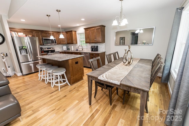 1005 8th Ave SW, Conover, NC 28613 - dining room featuring light wood-style floors, a chandelier, and recessed lighting