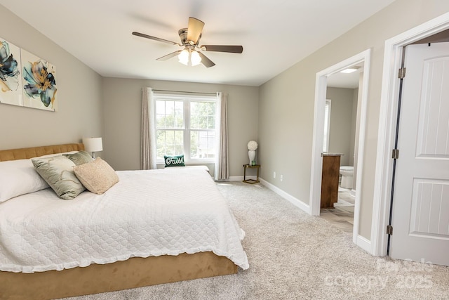 1005 8th Ave SW, Conover, NC 28613 - bedroom with light colored carpet, ensuite bath, and ceiling fan