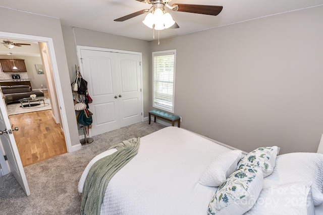 1005 8th Ave SW, Conover, NC 28613 - bedroom featuring light colored carpet, a closet, and a ceiling fan