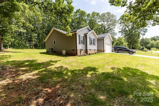 1005 8th Ave SW, Conover, NC 28613 - view of home's exterior with crawl space, a garage, a yard, driveway, and view of scattered trees
