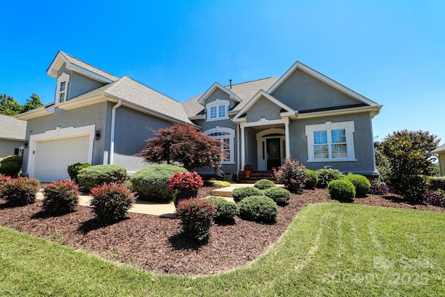 406 Spyglass Hill Pl, Salisbury, NC 28144 - view of front of house with a front lawn, stucco siding, and an attached garage