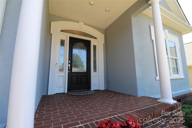 406 Spyglass Hill Pl, Salisbury, NC 28144 - doorway to property featuring stucco siding and covered porch