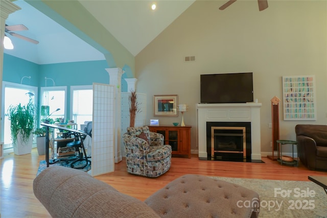 406 Spyglass Hill Pl, Salisbury, NC 28144 - living room with ceiling fan, high vaulted ceiling, wood finished floors, and a fireplace with flush hearth
