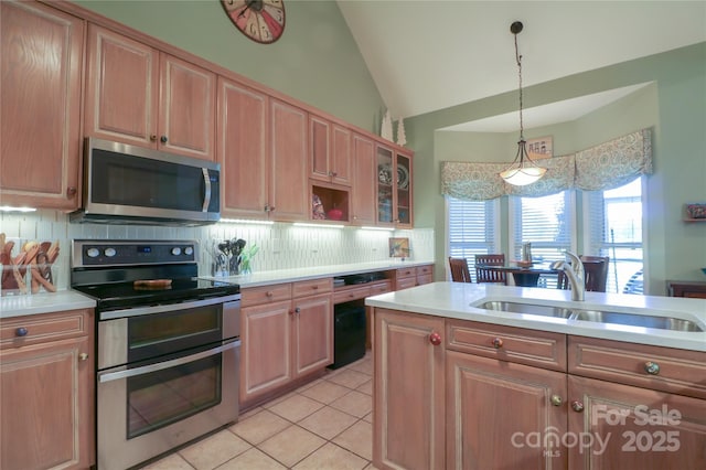 406 Spyglass Hill Pl, Salisbury, NC 28144 - kitchen featuring stainless steel appliances, lofted ceiling, light countertops, backsplash, and light tile patterned flooring