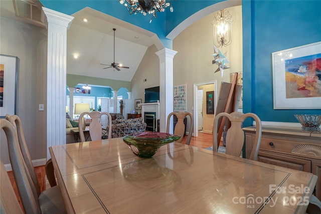 406 Spyglass Hill Pl, Salisbury, NC 28144 - dining room featuring ornate columns, high vaulted ceiling, arched walkways, a chandelier, and ceiling fan