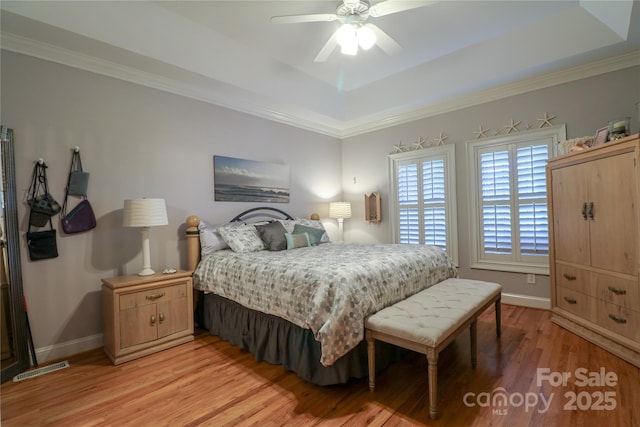 406 Spyglass Hill Pl, Salisbury, NC 28144 - bedroom with a raised ceiling, light wood finished floors, crown molding, and a ceiling fan