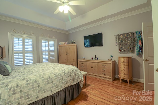 406 Spyglass Hill Pl, Salisbury, NC 28144 - bedroom featuring light wood-type flooring, a tray ceiling, ornamental molding, and a ceiling fan
