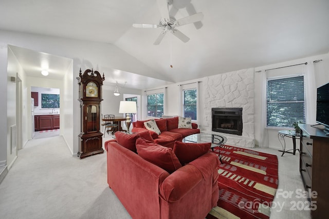 8416 Rittenhouse Cir, Charlotte, NC 28270 - living area featuring light colored carpet, a fireplace, vaulted ceiling, and a ceiling fan