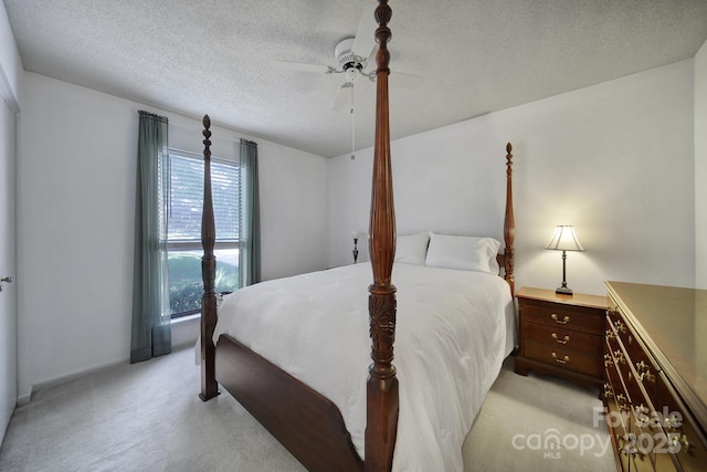 8416 Rittenhouse Cir, Charlotte, NC 28270 - bedroom with light colored carpet, a textured ceiling, and a ceiling fan