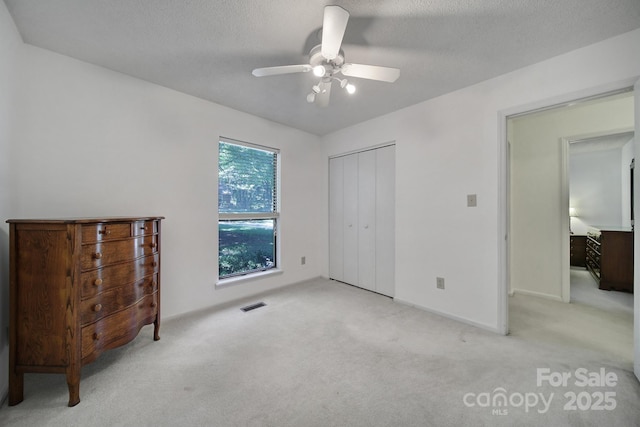 8416 Rittenhouse Cir, Charlotte, NC 28270 - unfurnished bedroom featuring light colored carpet, a closet, and ceiling fan