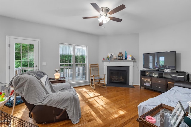 2953 Cameron Village Ct, Winston Salem, NC 27103 - living area featuring ceiling fan, light wood-style floors, and a fireplace with flush hearth