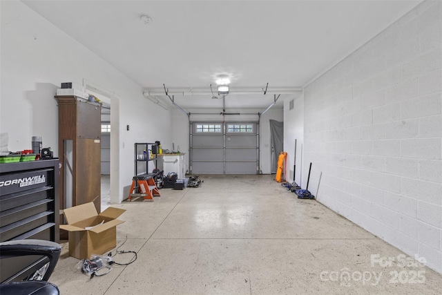 2953 Cameron Village Ct, Winston Salem, NC 27103 - garage with concrete block wall and a garage door opener