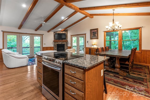380 Allison Dr, Maggie Valley, NC 28751 - kitchen featuring stainless steel electric range, french doors, wainscoting, ceiling fan, and open floor plan
