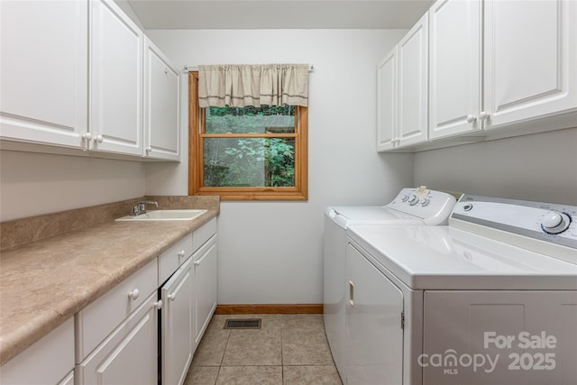 380 Allison Dr, Maggie Valley, NC 28751 - laundry area with independent washer and dryer, cabinet space, and light tile patterned floors