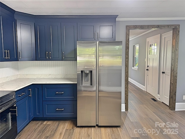 201 Barnes Ln, Stony Point, NC 28678 - kitchen with stainless steel refrigerator with ice dispenser, crown molding, blue cabinetry, black electric range, and light wood-type flooring