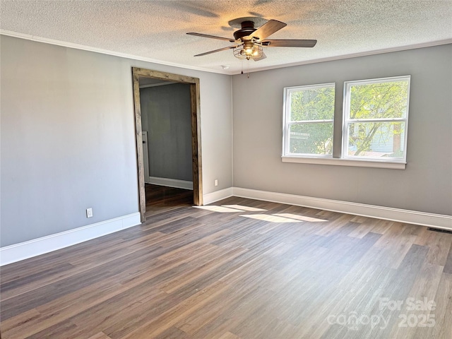 201 Barnes Ln, Stony Point, NC 28678 - spare room featuring a textured ceiling, a ceiling fan, wood finished floors, and crown molding