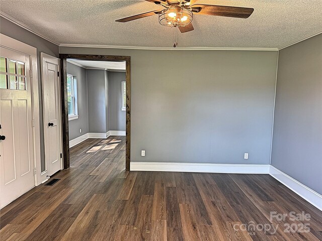 201 Barnes Ln, Stony Point, NC 28678 - spare room with a textured ceiling, dark wood-style flooring, a ceiling fan, and crown molding