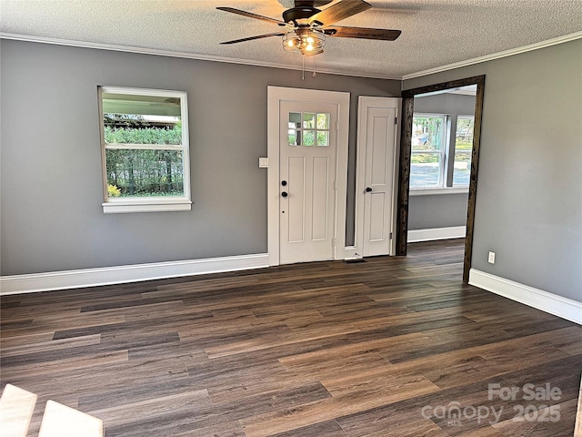 201 Barnes Ln, Stony Point, NC 28678 - entryway with ornamental molding, ceiling fan, dark wood-type flooring, and a textured ceiling