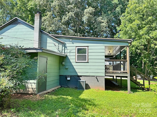201 Barnes Ln, Stony Point, NC 28678 - rear view of property featuring a yard, a chimney, and a deck