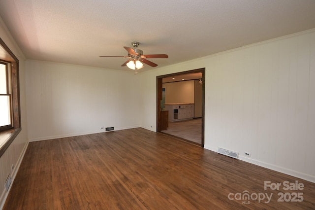 7645 Robinson Church Rd, Harrisburg, NC 28075 - empty room with a ceiling fan and wood finished floors