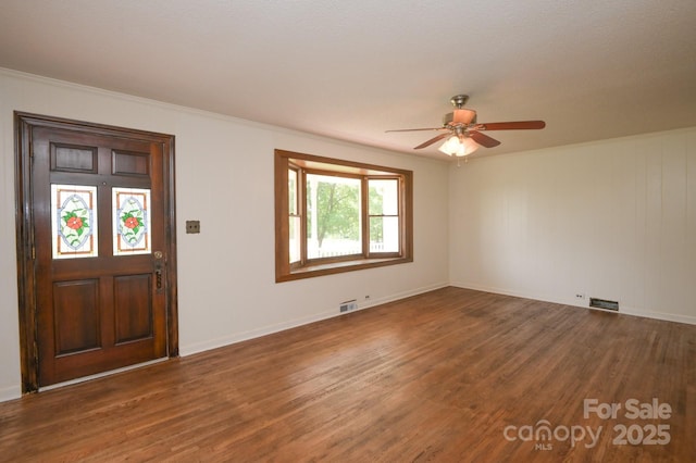 7645 Robinson Church Rd, Harrisburg, NC 28075 - entryway with wood finished floors, a ceiling fan, and ornamental molding