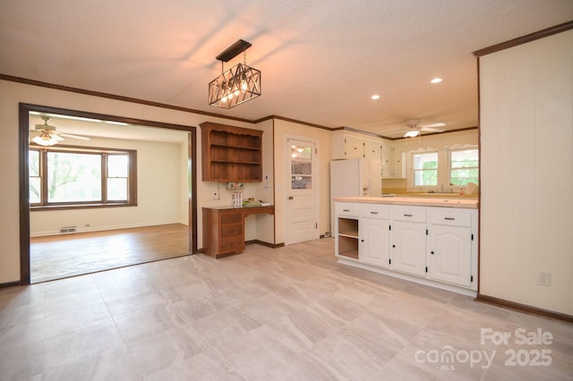 7645 Robinson Church Rd, Harrisburg, NC 28075 - kitchen with open shelves, a ceiling fan, white cabinets, ornamental molding, and recessed lighting