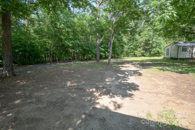 7645 Robinson Church Rd, Harrisburg, NC 28075 - view of yard with a view of trees
