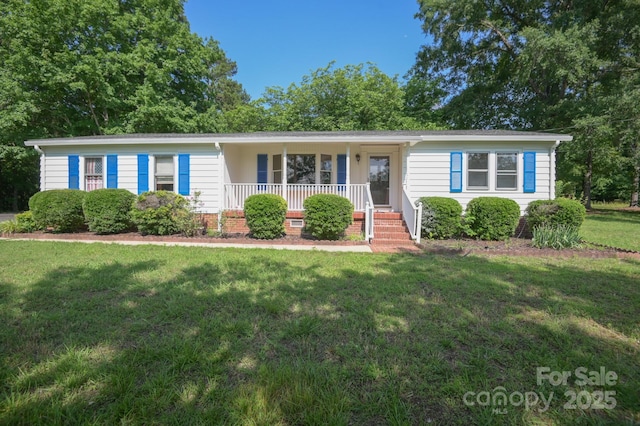 7645 Robinson Church Rd, Harrisburg, NC 28075 - ranch-style house with a porch and a front yard