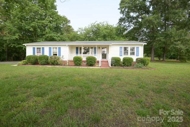 7645 Robinson Church Rd, Harrisburg, NC 28075 - single story home with a porch and a front yard