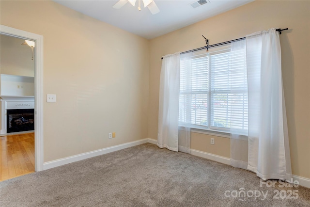2785 Clover Rd NW, Concord, NC 28027 - spare room with ceiling fan and carpet flooring