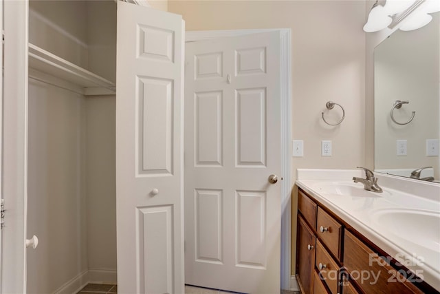 2785 Clover Rd NW, Concord, NC 28027 - bathroom featuring double vanity and baseboards