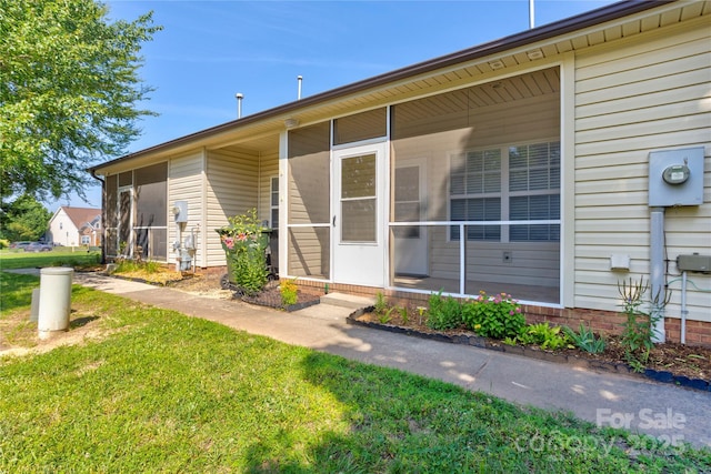 2785 Clover Rd NW, Concord, NC 28027 - view of exterior entry featuring a yard