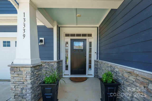 13339 Mcguffy Dr, Huntersville, NC 28078 - doorway to property with covered porch and stone siding