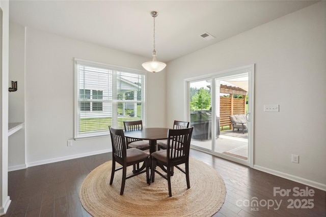 13339 Mcguffy Dr, Huntersville, NC 28078 - dining space featuring dark wood finished floors and baseboards
